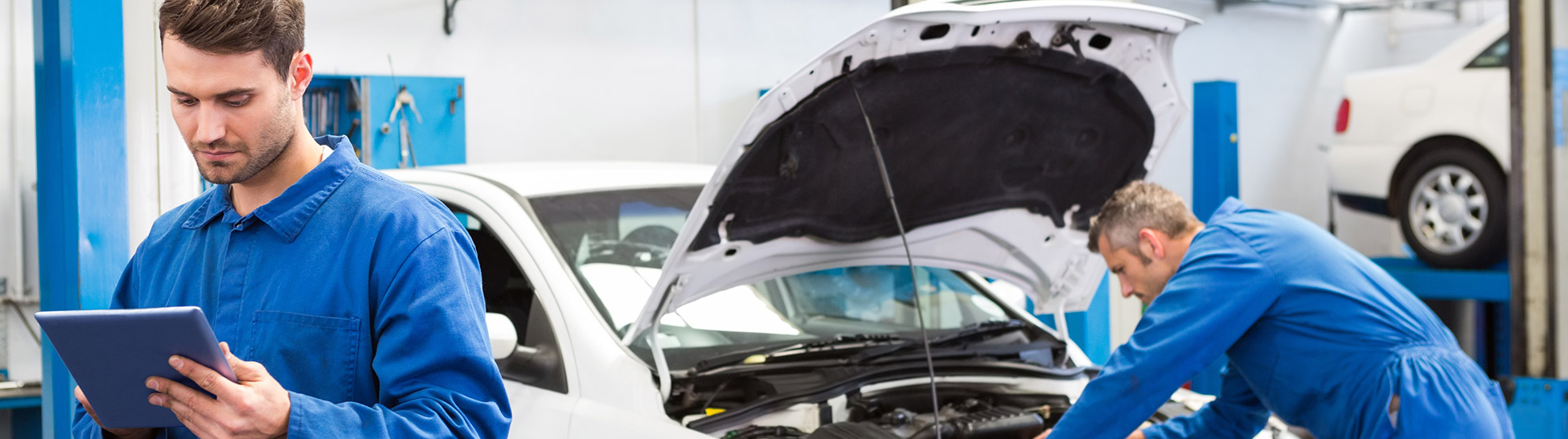 Auto Repair Technicians Working on a Car